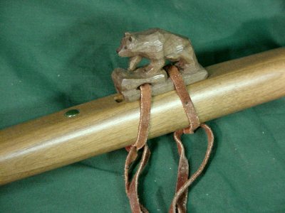 dinosaur with flute on head